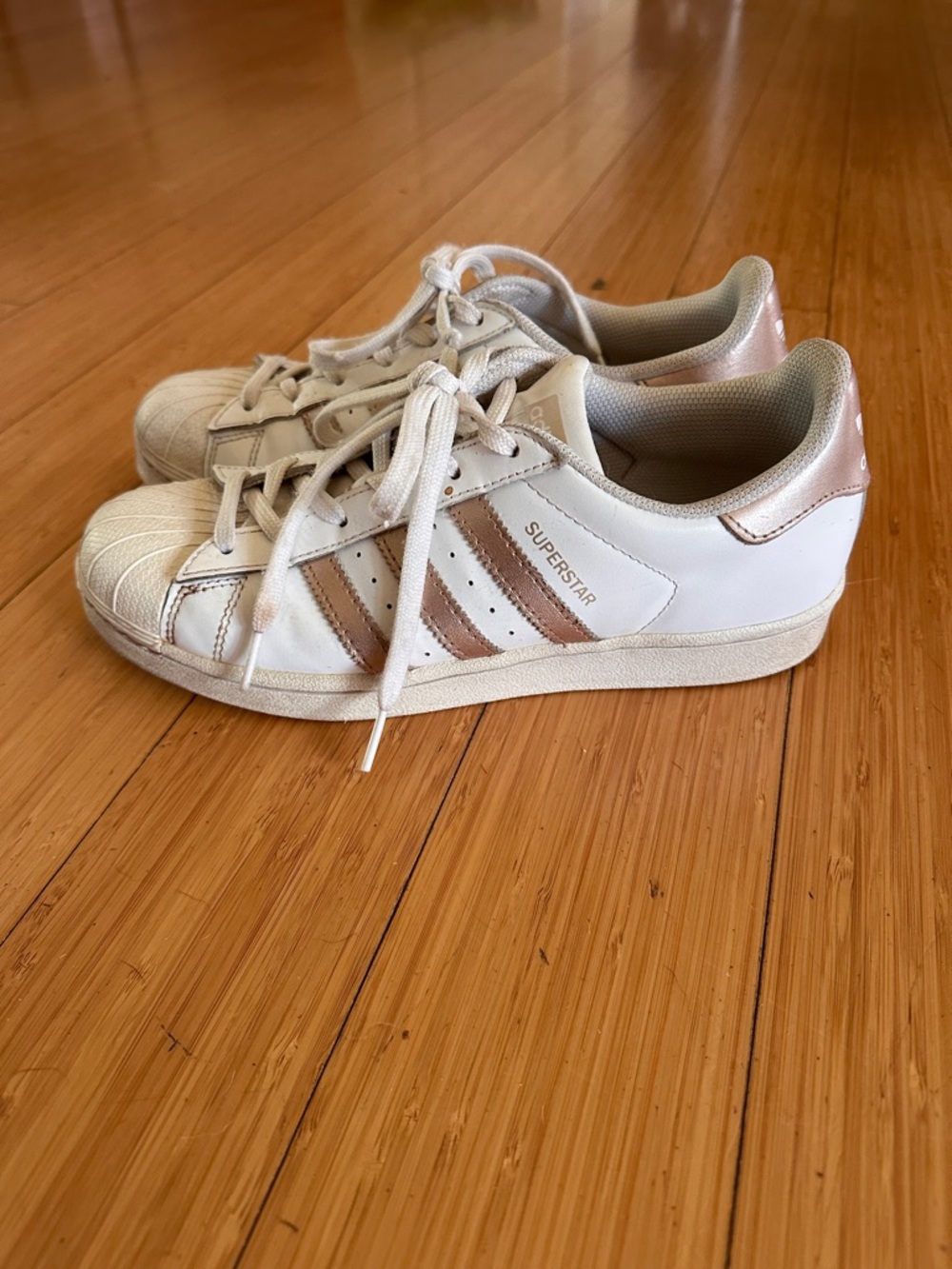 Adidas Superstar Sneakers in White with Gold Stripes